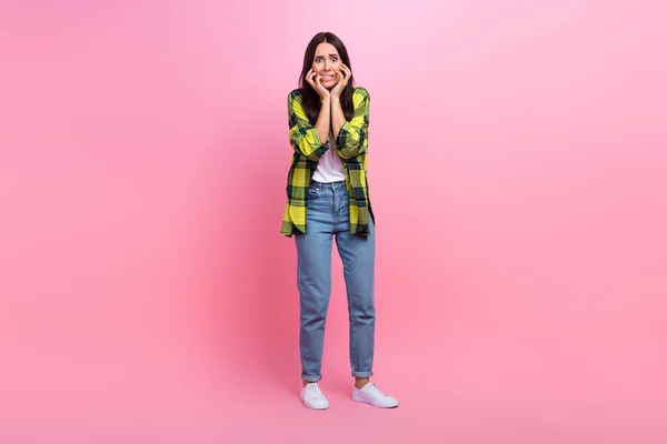 Full length photo of scared terrified lady wear checkered jacket biting fingers isolated pink color background.