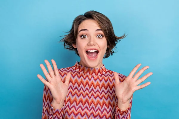 Closeup photo charming excited lady hands up in air open mouth overjoyed news wear print top isolated blue color background.