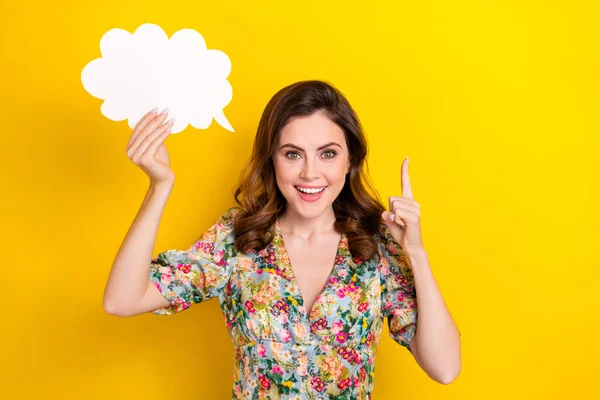 stock image Portrait of excited pretty lady hand hold empty space cloud figure card point finger isolated on yellow color background.