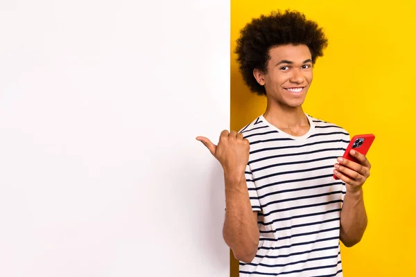 Photo Young Optimistic Man Wear Shirt Point Finger Hold Phone — Stock Photo, Image