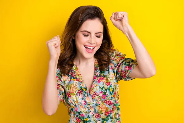 stock image Portrait of delighted cheerful person closed eyes raise fists triumph isolated on yellow color background.