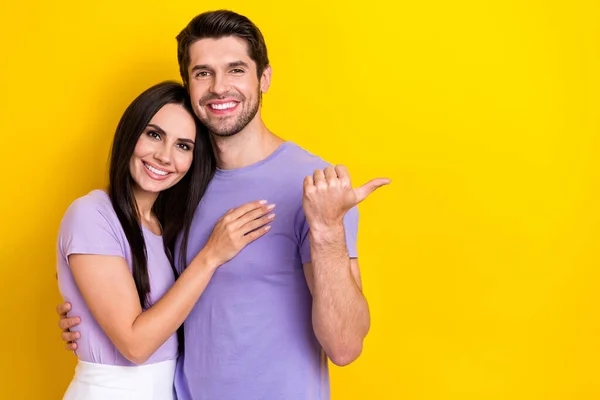 Portrait Two Cheerful Lovely People Hug Indicate Finger Empty Space — Stock Photo, Image