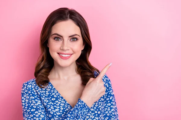 stock image Photo of satisfied friendly woman with wavy hairdo dressed blue blouse indicating at sale empty space isolated on pink color background.