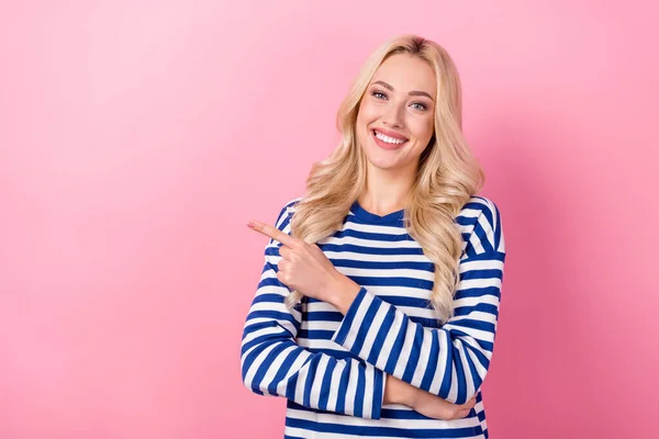 stock image Photo of sweet adorable woman dressed striped shirt pointing finger empty space isolated pink color background.