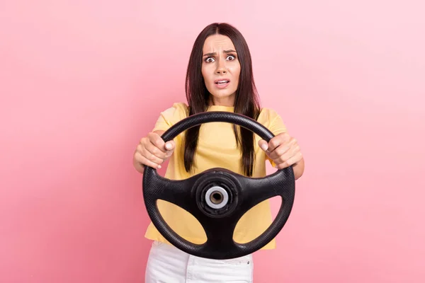 stock image Photo of stupor confused woman dressed yellow t-shirt riding car stuck in traffic jam isolated pink color background.