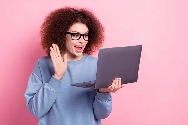 Photo of funky excited lady dressed blue pullover eyewear communicating modern device isolated pink color background.