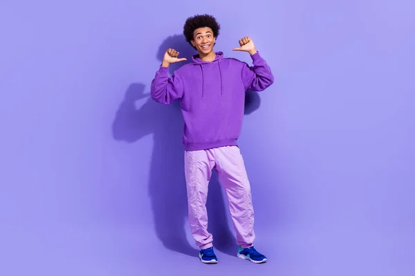 stock image Full body cadre of young guy wear stylish outfit direct fingers himself personal branding good choice isolated on violet color background.