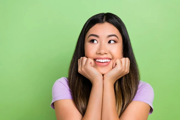 stock image Photo of pretty vietnamese chinese young girl look empty space admire dressed stylish violet outfit isolated on green color background.