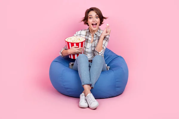 Full Length Portrait Impressed Person Sit Comfy Bag Eat Popcorn — Stock Photo, Image