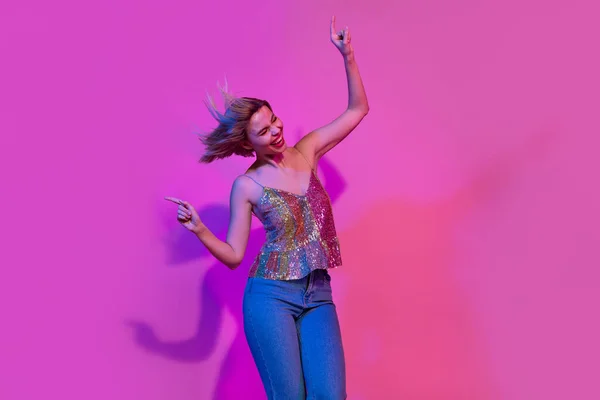 Stock image Photo of excited active lady enjoy weekend friday party moving dancing isolated on colorful neon background.