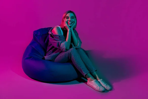 Photo Positive Youth Lady Sit Beanchair Dreaming Isolated Ultraviolet Multicolor — Stock fotografie