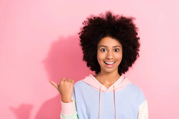 stock image Portrait of cheerful astonished person beaming smile indicate thumb finger empty space isolated on pink color background.