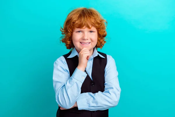 stock image Photo of intelligent minded positive kid hand touch chin toothy smile contemplate isolated on teal color background.