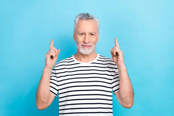 stock image Photo of handsome retired aged man direct fingers empty space advertising hospital clinic healthcare isolated blue color background.