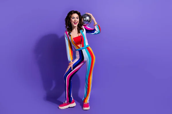 Stock image Photo of excited lady dj enjoy friday weekend party bring glitter glowing disco ball isolated on bright color background.