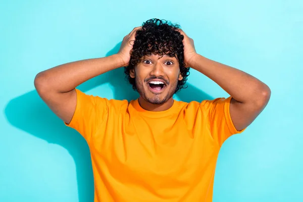 stock image Portrait of funny guy hands head shocked open mouth unexpected reaction crazy good news approved job isolated on blue color background.