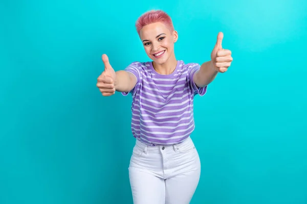 Photo of pretty friendly person toothy smile hands fingers demonstrate thumb up isolated on teal color background.