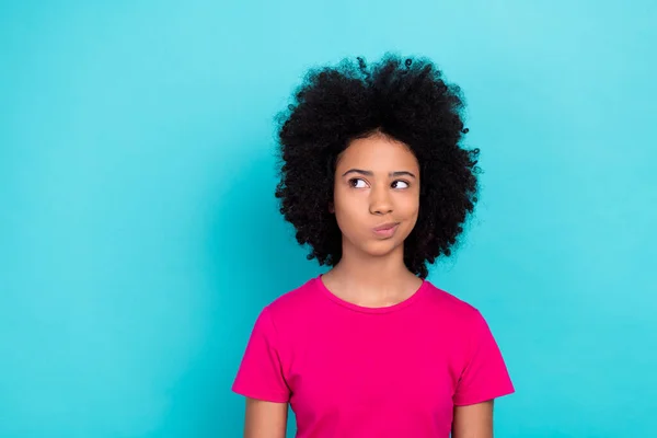 stock image Portrait of minded schoolkid look interested empty space ponder hesitate isolated on turquoise color background.