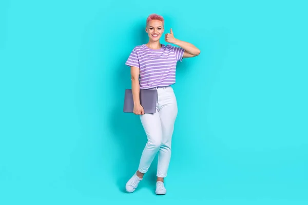 Full body length photo of young hr manager woman works thumb up her new office holding laptop acer isolated on aquamarine color background.