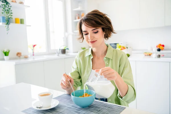 Photo Charming Cute Lady Dressed Green Shirt Pouring Milk Preparing — Stock Photo, Image