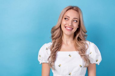 Photo of wearing stylish blouse girlfriend cheerful looking empty space dreams about clean white teeth isolated on blue color background. clipart