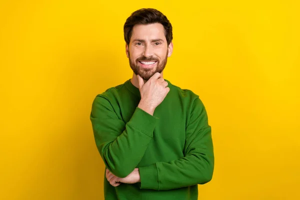 Portrait of executive director young businessman wear green trendy sweater touch chin decide new idea isolated on yellow color background.