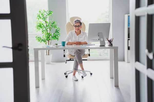 Full body portrait of cheerful confident leader businesswoman sitting hands table working remote from home perfect desktop isolated indoors.