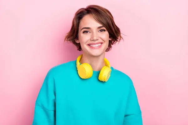 Portrait of cheerful gorgeous lady beaming smile hang neck wireless headphones isolated on pink color background.