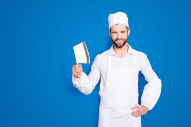 Portrait of positive cheerful handsome butcher having cleaver in arm holding hand on waist, looking at camera, isolated on grey background. clipart