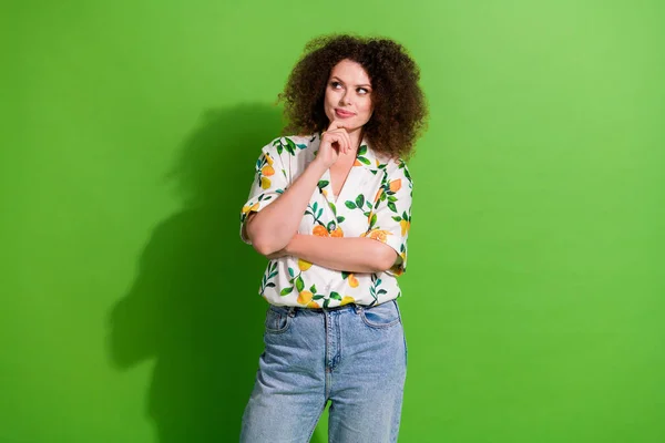 stock image Photo of pretty thoughtful girl dressed print shirt arm chin looking empty space isolated green color background.