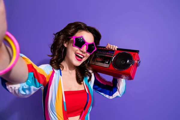 Portrait of excited lady hold boom box make selfie recording video for internet blogging isolated vivid color background.