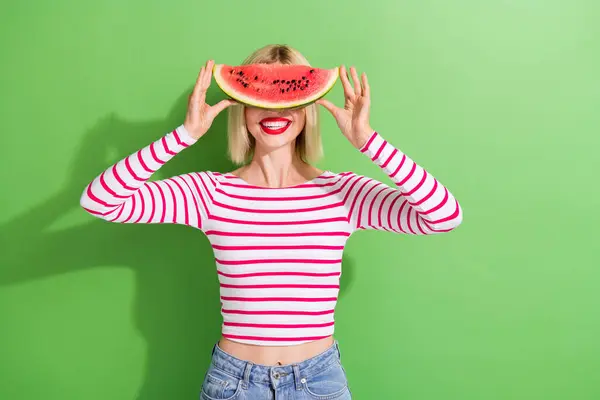 stock image Photo of funny pleasant playful woman with bob hairstyle wear striped shirt hold watermelon on face isolated on green color background.