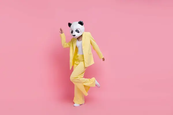 Full size portrait of weird 3d panda mask classy girl enjoy dancing chilling empty space isolated on pink color background.