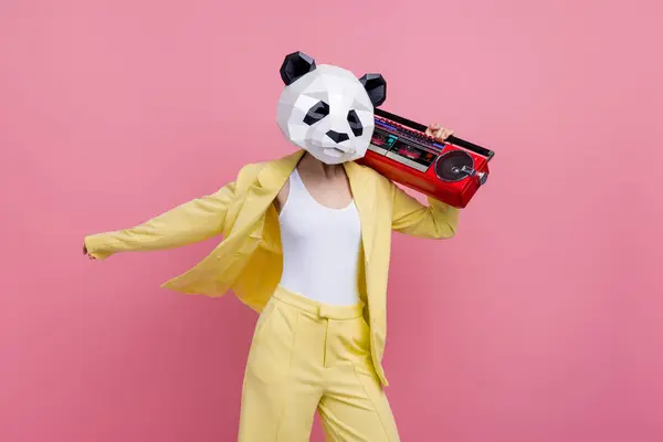 Portrait of cool funky 3d panda mask lady dancing carry boombox rejoice isolated on pink color background.