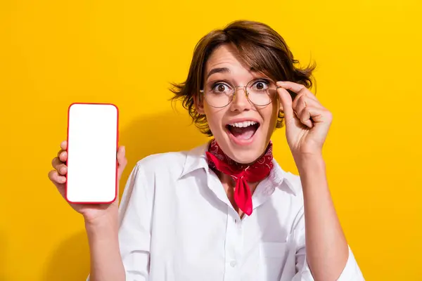 stock image Photo of amazed excited girl woman wear white stylish clothes showing eshop ebank website empty space isolated on yellow color background.