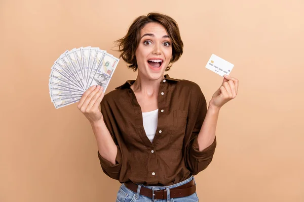 Photo Impressed Satisfied Woman Dressed Brown Shirt Hold Money Credit — Stock Photo, Image