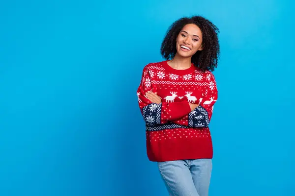 stock image Photo of young lady folded hands enjoying outfit for christmas eve party wearing ugly sweater with jeans isolated on blue color background.