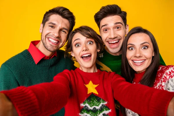 Photo of excited best buddies have fun on christmas x mas event make selfie portrait isolated over shine color background.