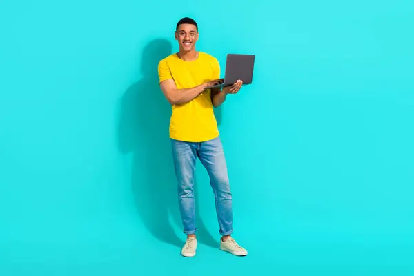 Full body portrait of positive person hands hold use wireless netbook coworking isolated on turquoise color background.