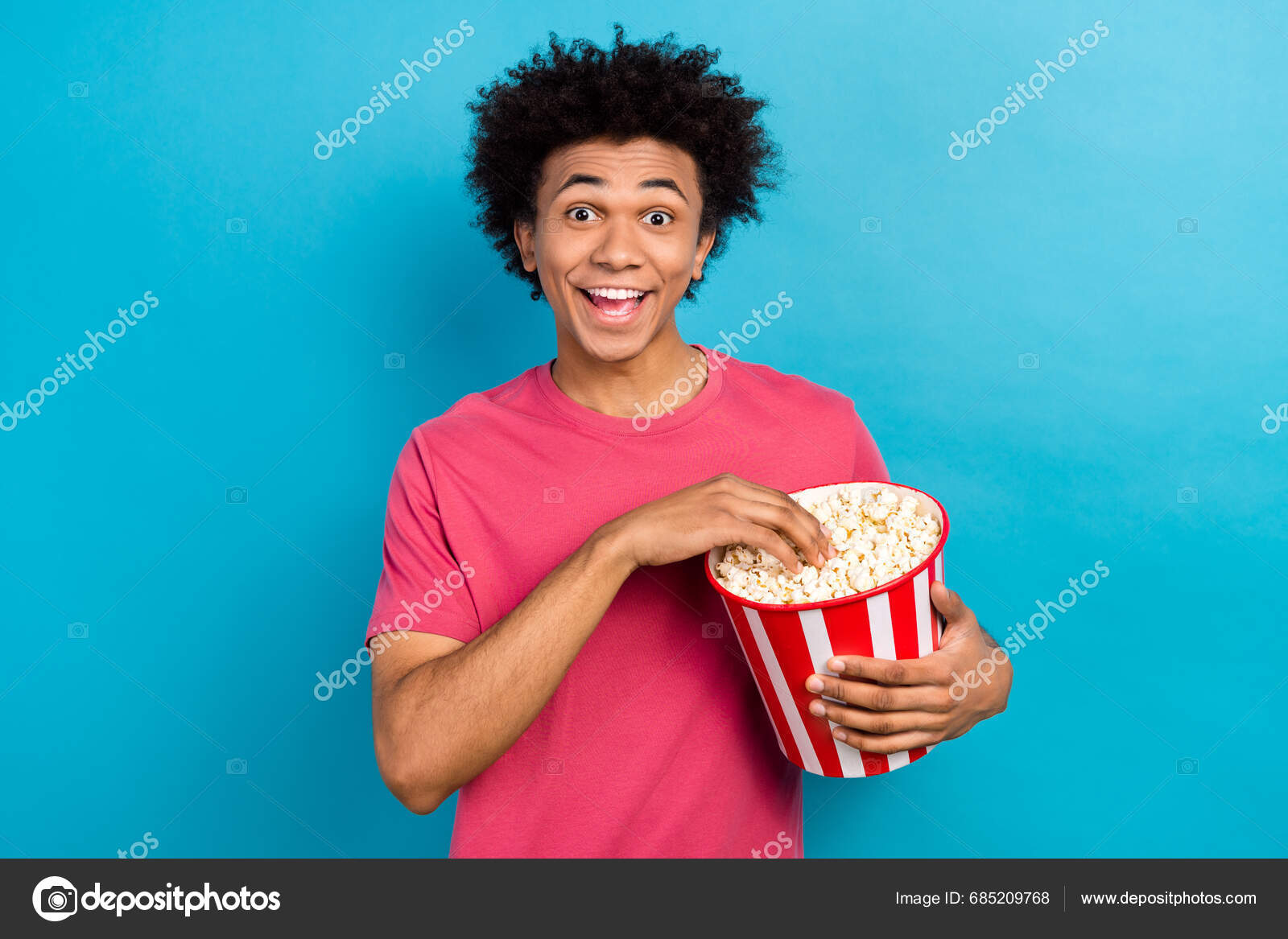 Photo Impressed Guy Afro Hairdo Wear Pink Shirt Eat Popcorn Stock Photo