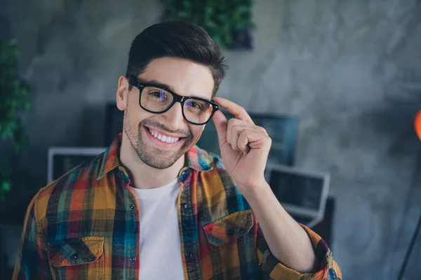 Portrait of positive smart cyber security expert guy toothy smile arm touch glasses modern office workplace indoors.