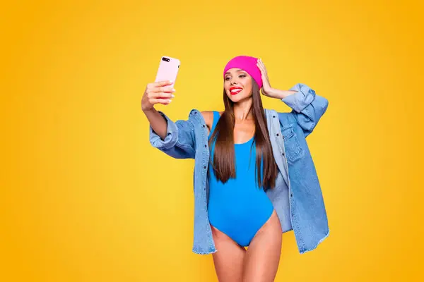 Life stream video selfie mania Studio photo portrait of attractive cheerful fun joy joyful girl making taking self picture posing for camera isolated pastel background copy space.