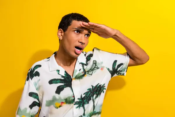 Photo of shocked surprised guy wear trendy clothes arm touch forehead looking far away empty space isolated on yellow color background.