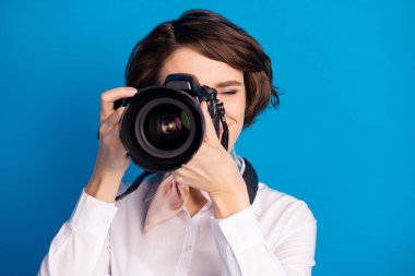 Photo of positive pretty lady arms hold camera taking picture tied on neck scarf isolated on blue color background. clipart