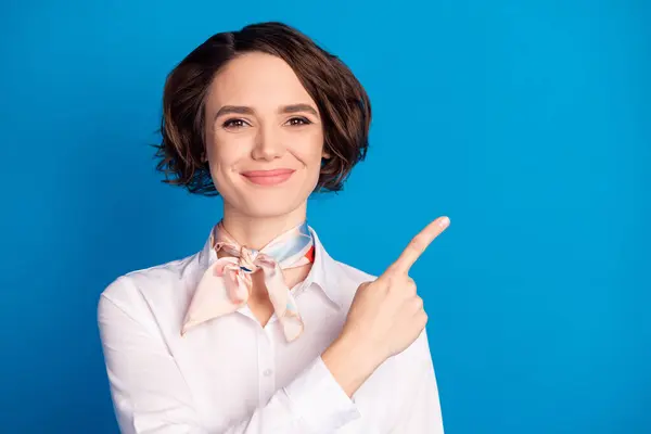 Portrait of satisfied person smile indicate finger empty space proposition isolated on blue color background.