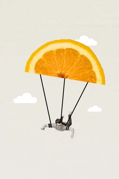 Artwork magazine collage picture of happy funny young guy flying parachute orange slice fruit in sky isolated on gray color background.