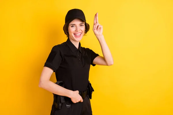 Portrait of friendly person toothy smile hand fingers show pistol figure isolated on yellow color background.