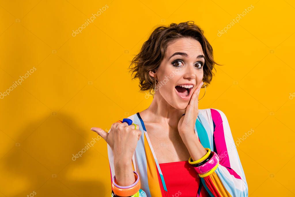 Photo of wow girl hand touch cheekbone unexpected pointing finger empty space retro nostalgia event isolated on yellow color background.