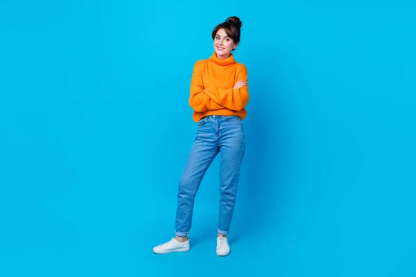Full length photo of pretty good mood lady wear knitted pullover arms folded smiling isolated blue color background.