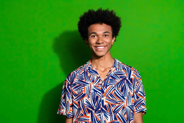 Portrait of friendly positive guy wear trendy print shirt toothy beaming smile optimistic summertime isolated on green color background.